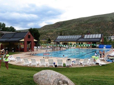 EagleVail Community Pool heated with a combination of Solene Aurora flat-plate solar thermal panels and Heliocol solar pool heating panels.